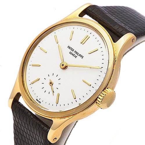 The image shows a Patek Philippe Vintage watch at a slight angle, highlighting the gold case, white dial, crown, and black leather strap.