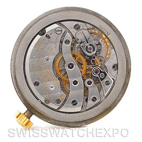 This image shows the movement and intricate internal mechanics of a Vintage Patek Philippe watch, viewed from the back side.
