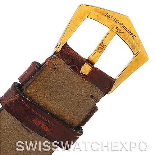 This image shows the buckle of a Vintage Patek Philippe watch strap, highlighting the 18K gold clasp.