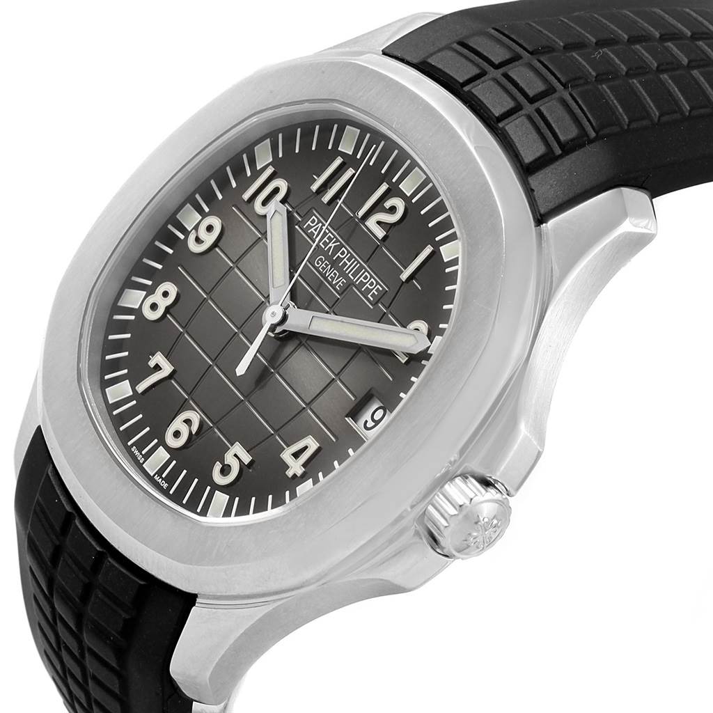 This image shows a partial side and front view of the Patek Philippe Aquanaut PATEK PHILIPPE Men's Stainless Steel Black Dial PATEK PHILIPPE Men's Stainless Steel Black Dial watch, highlighting the dial, crown, and strap.