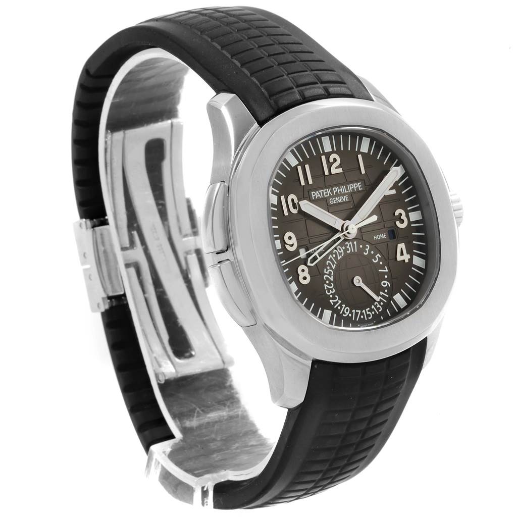 The image shows a Patek Philippe Aquanaut 5164A Men's Stainless Steel Black Dial 5164A Men's Stainless Steel Black Dial watch at an angle highlighting the dial, bezel, and black rubber strap.