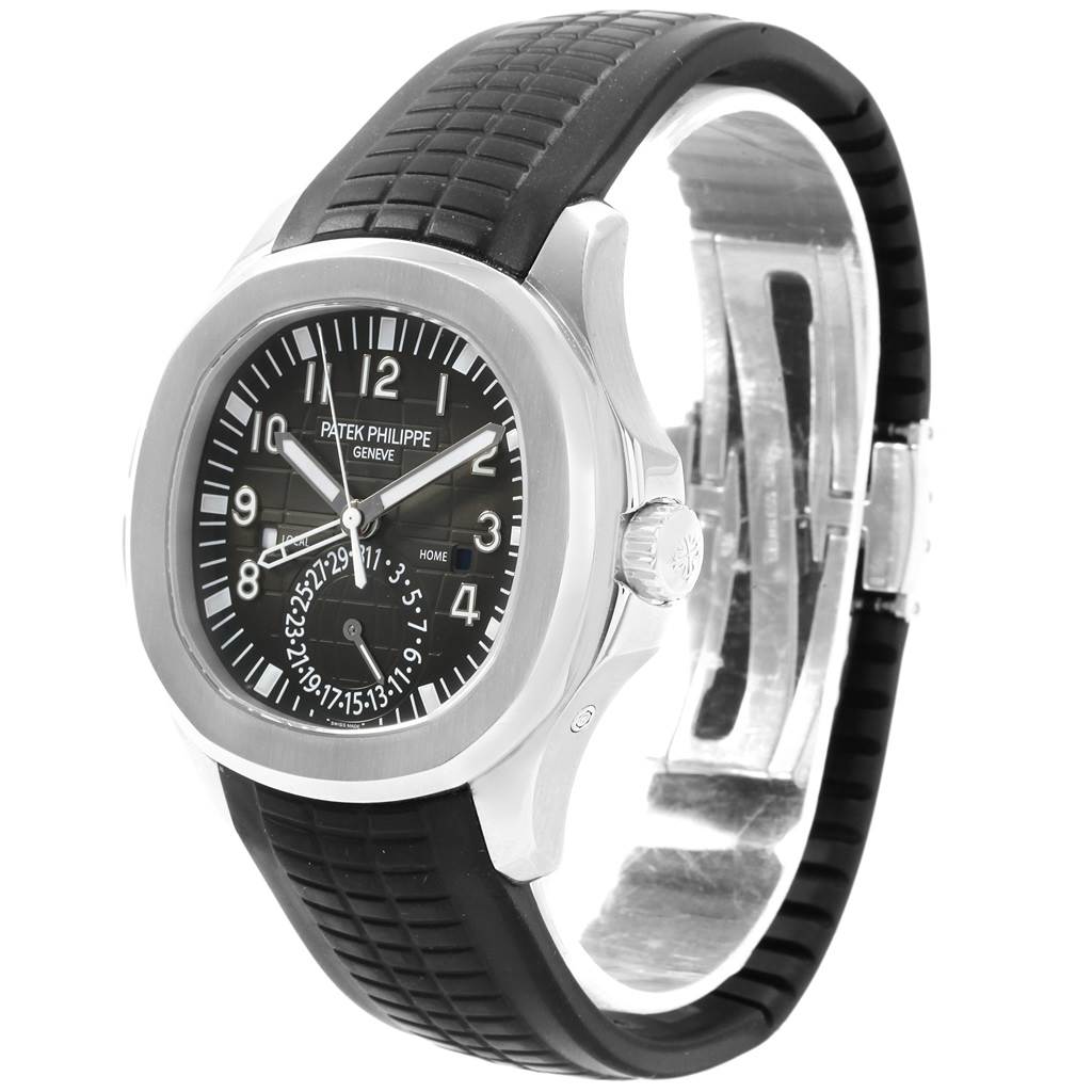 This image shows a Patek Philippe Aquanaut 5164A Men's Stainless Steel Black Dial 5164A Men's Stainless Steel Black Dial watch at a three-quarter angle, focusing on its face, case, crown, and black rubber strap.
