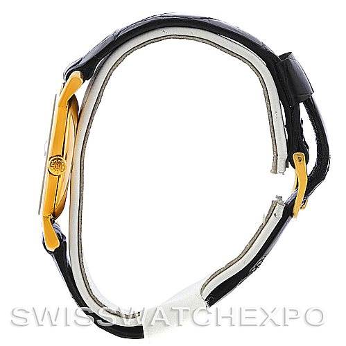 The image shows a side view of a Vintage Patek Philippe watch, featuring its crown, case, and leather strap.