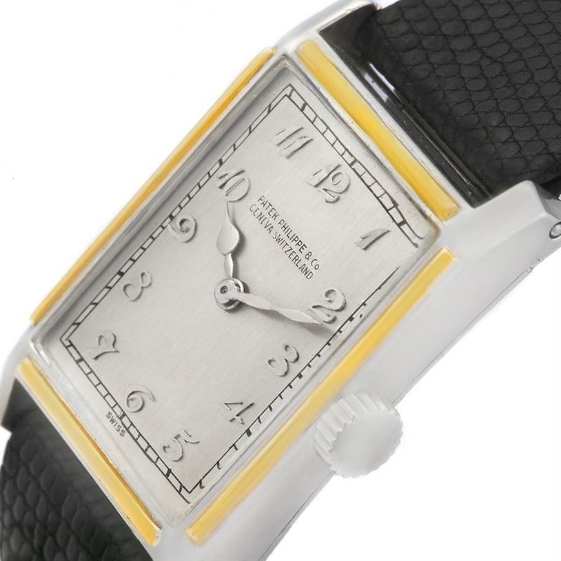 This is a close-up angled view of a Vintage Patek Philippe watch, showing the dial, crown, and parts of the strap.