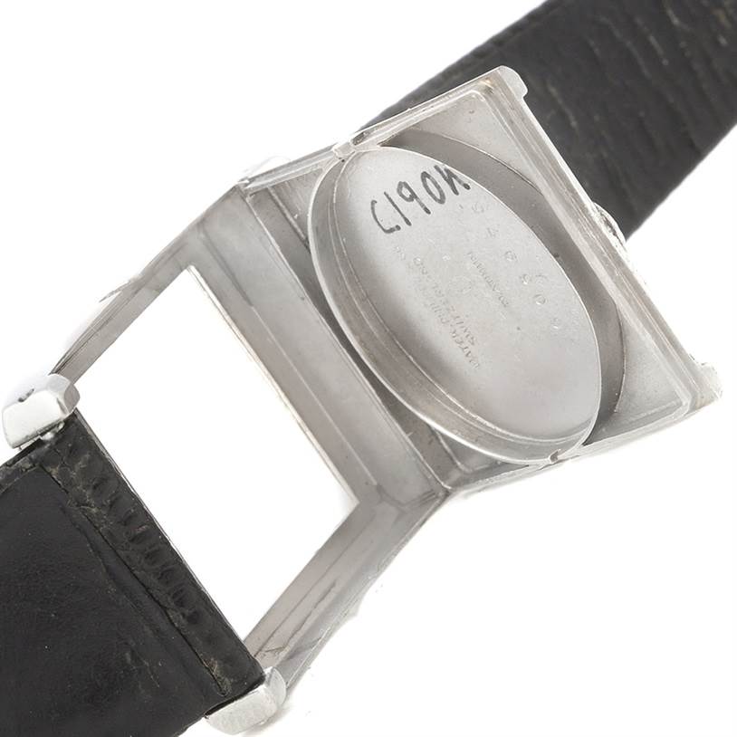 This image shows the back of the opened case of a Vintage Patek Philippe watch, revealing the inner cover.