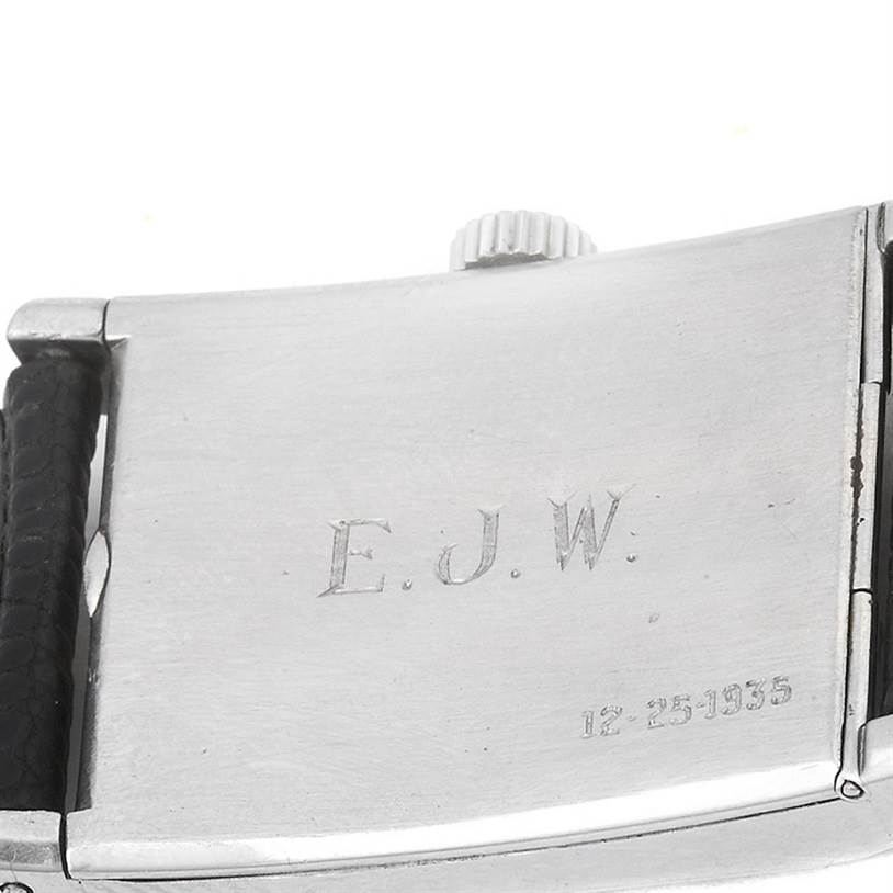 The image shows the engraved case back and crown of a vintage Patek Philippe watch.