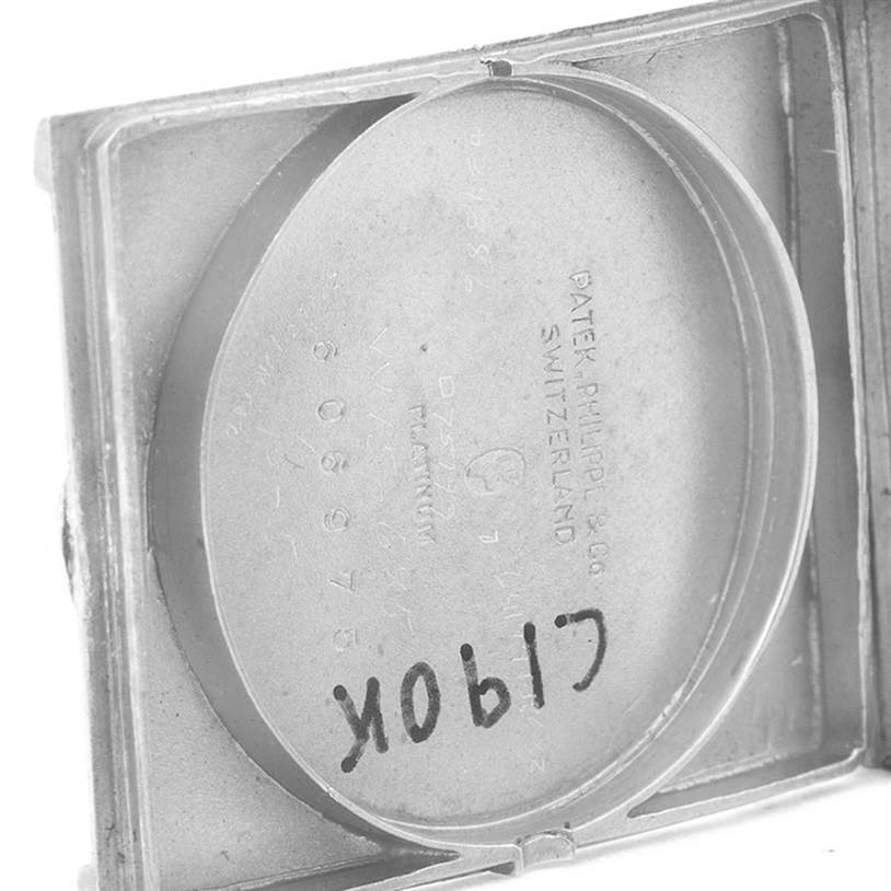 This image displays the inside case back of a vintage Patek Philippe watch, showcasing markings and engravings.