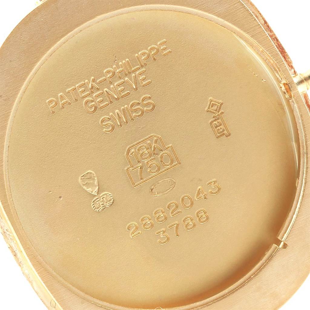 The image shows the interior case back of a Patek Philippe Golden Ellipse 3788 Men's Yellow Gold Blue Dial 3788 Men's Yellow Gold Blue Dial watch, highlighting the engravings and hallmarks.