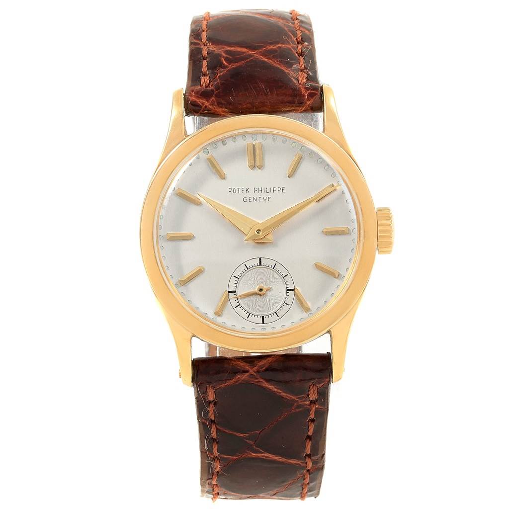 This image shows a frontal view of a Vintage Patek Philippe watch with a brown leather strap and a gold case.