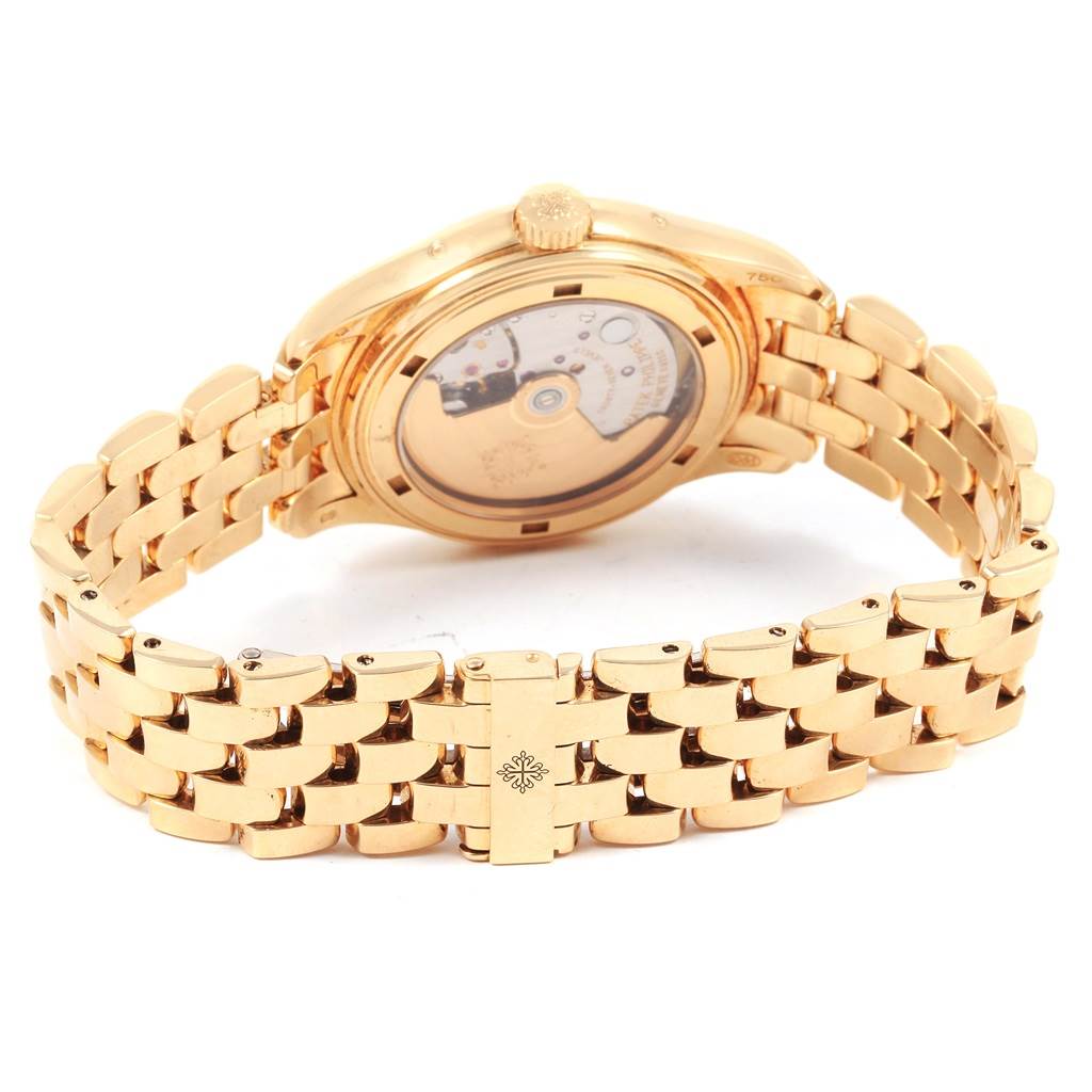 The image shows the back case and bracelet of the Patek Philippe 5036 Men's Yellow Gold White Dial 5036 Men's Yellow Gold White Dial Annual Calendar Moonphase Yellow Gold Mens Watch 5036 model.