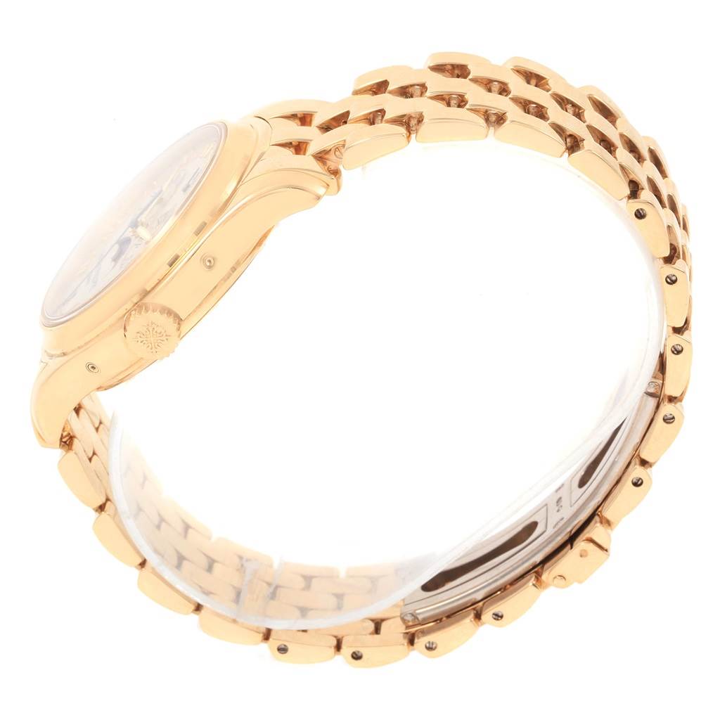 This image shows a side view of the Patek Philippe 5036 Men's Yellow Gold White Dial 5036 Men's Yellow Gold White Dial 5036 Annual Calendar Moonphase Yellow Gold Men's Watch, focusing on the crown and bracelet.