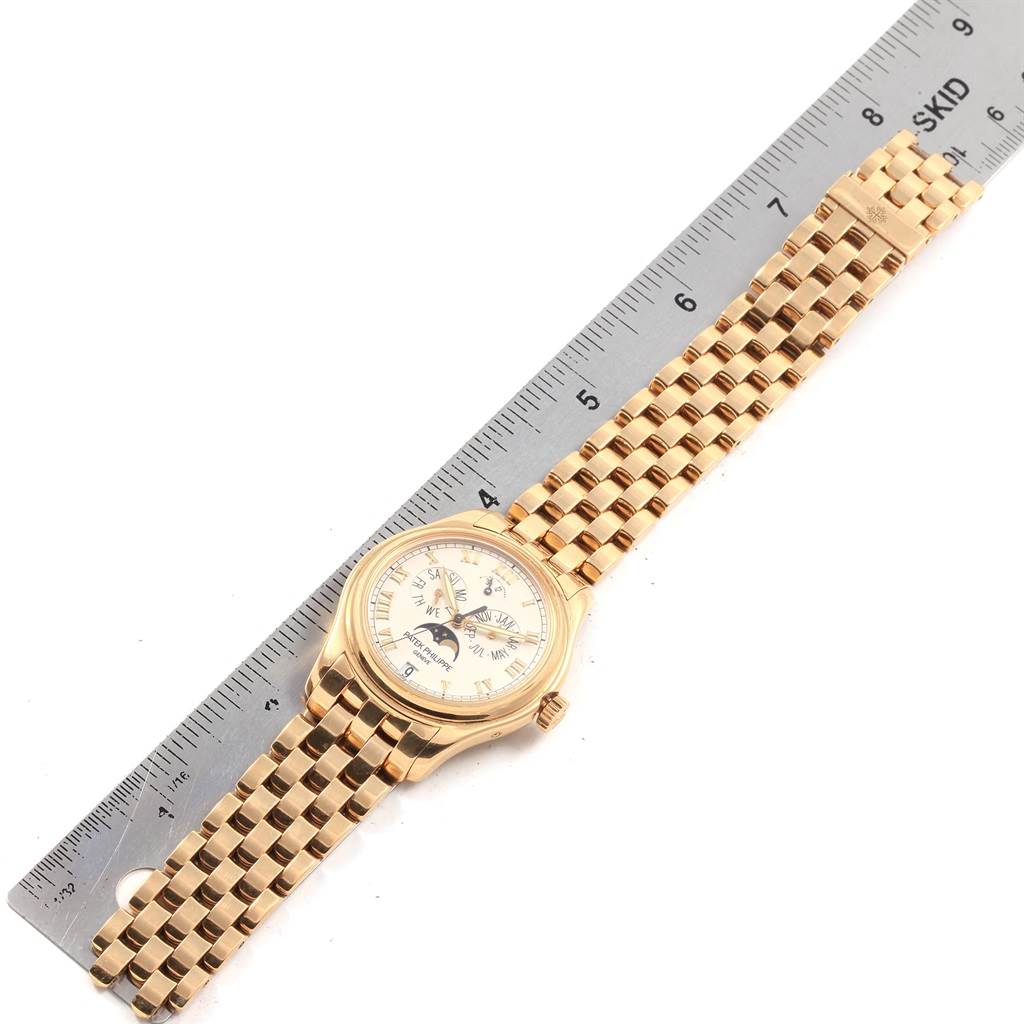 The image shows a Patek Philippe 5036 Men's Yellow Gold White Dial 5036 Men's Yellow Gold White Dial Annual Calendar Moonphase 5036 Men's Watch in yellow gold, photographed flat with a ruler.