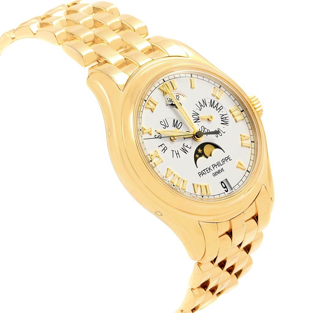 The image shows a side-angle view of the Patek Philippe 5036 Men's Yellow Gold White Dial 5036 Men's Yellow Gold White Dial Annual Calendar Moonphase Yellow Gold Mens Watch 5036, highlighting its dial and bracelet.