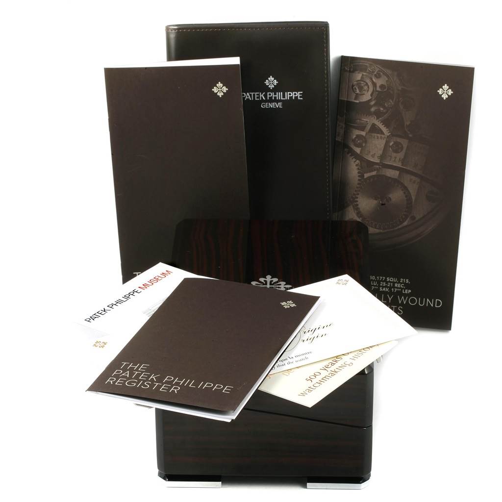 The image shows a Patek Philippe Gondolo 5124G Men's White Gold Blue Dial 5124G Men's White Gold Blue Dial watch box with accompanying booklets and manuals.