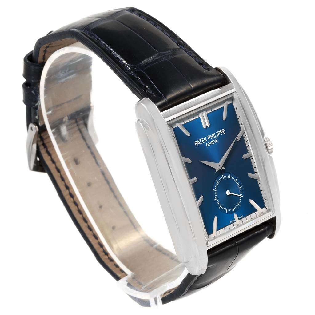 The image shows a side-angle view of a Patek Philippe Gondolo 5124G Men's White Gold Blue Dial 5124G Men's White Gold Blue Dial watch featuring its blue dial and black leather strap.