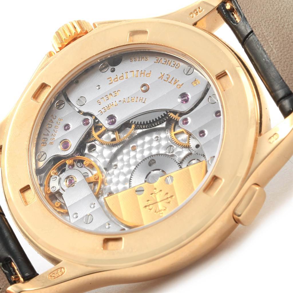 The image shows the detailed back view of the inner mechanics of a Patek Philippe Complications 5110J Men
s Yellow Gold Silver Dial 5110J Men
s Yellow Gold Silver Dial model watch.