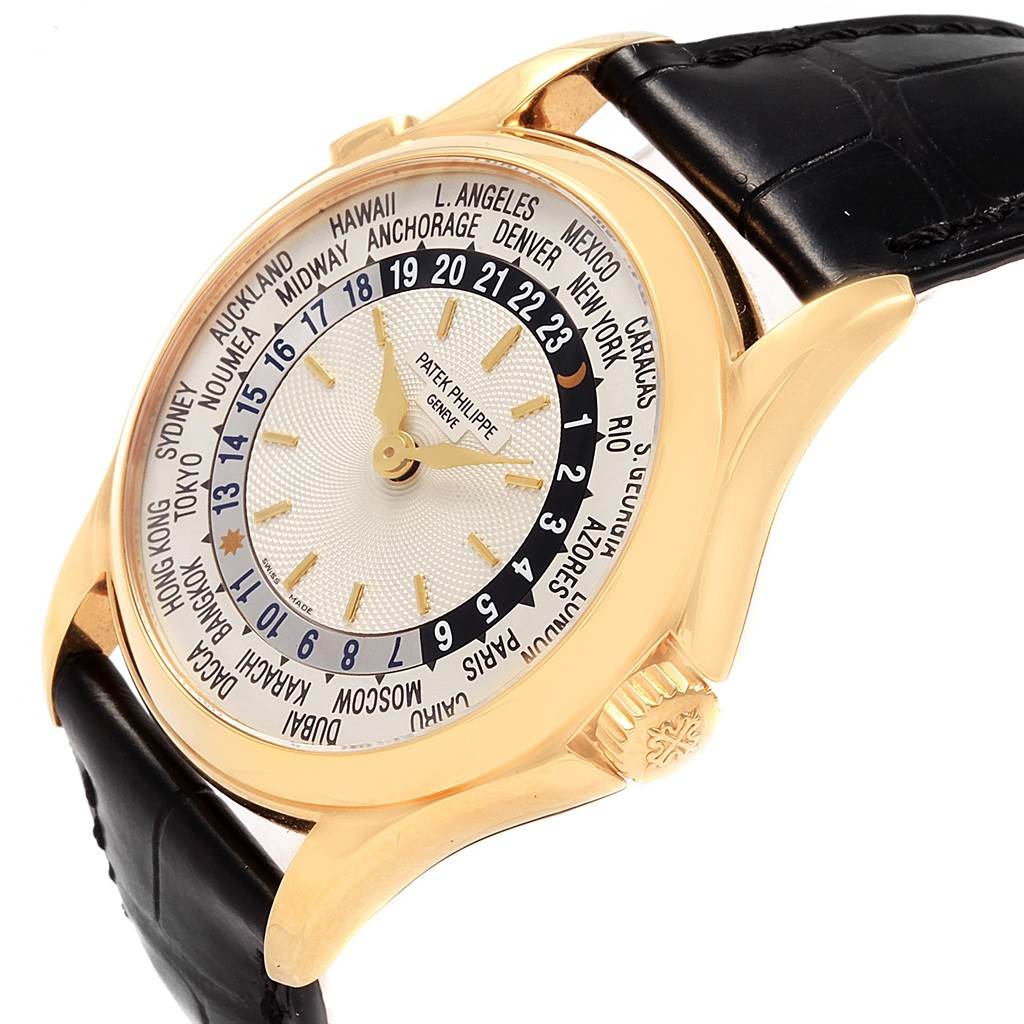 The image shows a side angle of the Patek Philippe Complications 5110J Men
s Yellow Gold Silver Dial 5110J Men
s Yellow Gold Silver Dial watch, highlighting its face, bezel, crown, and leather strap.