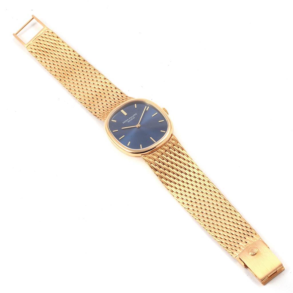 The image shows a Patek Philippe Golden Ellipse 3548 Men's Yellow Gold Blue Dial 3548 Men's Yellow Gold Blue Dial watch laid flat, displaying its mesh strap, blue dial, and gold case from a top view.