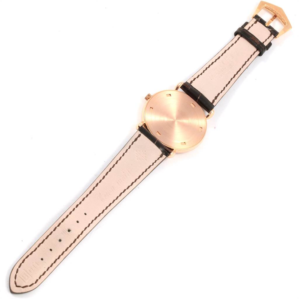 The image shows a top view of the Vintage Patek Philippe watch, highlighting the watch face and leather strap.