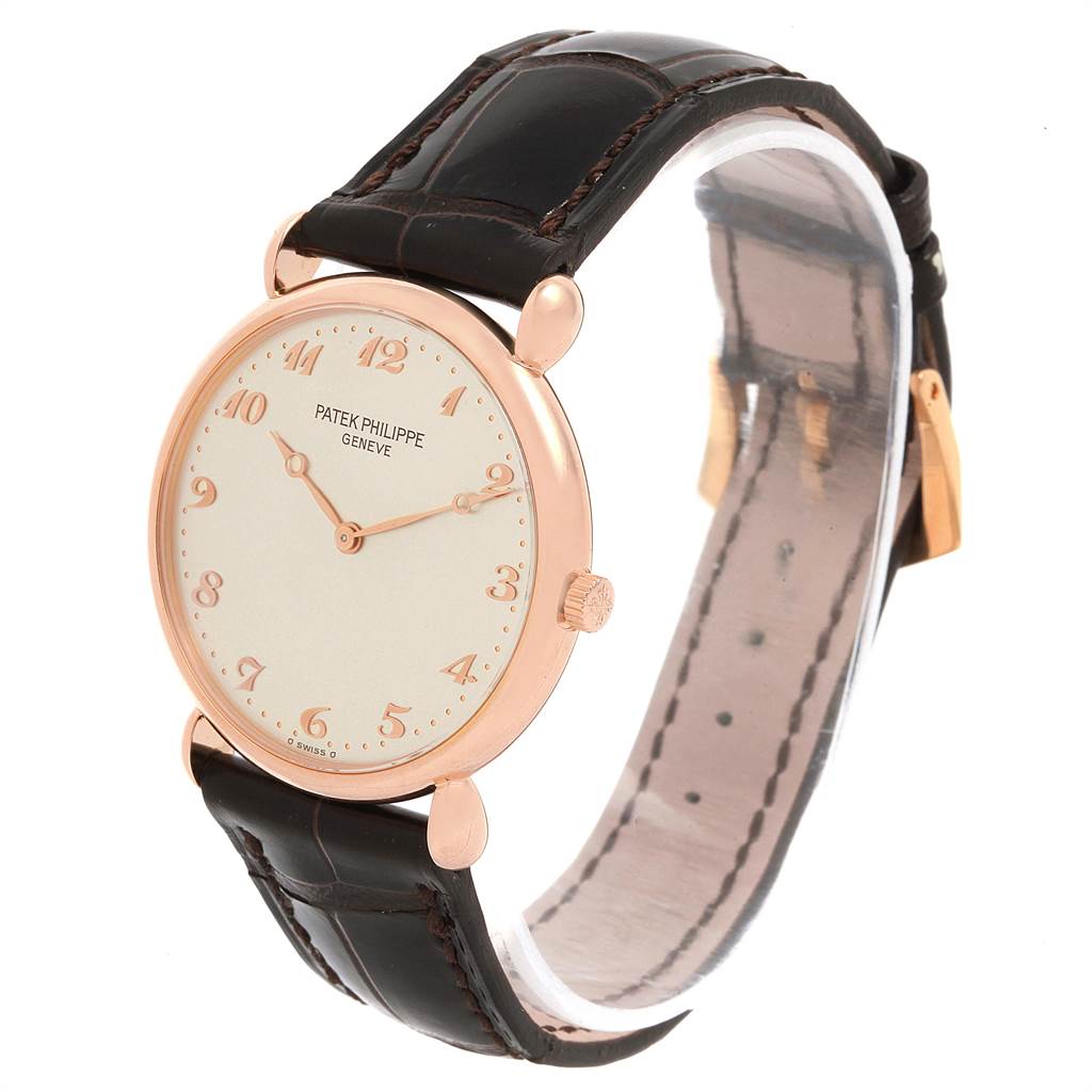 This Patek Philippe Vintage model watch is shown at a three-quarter angle, displaying the face, dial, and leather strap.