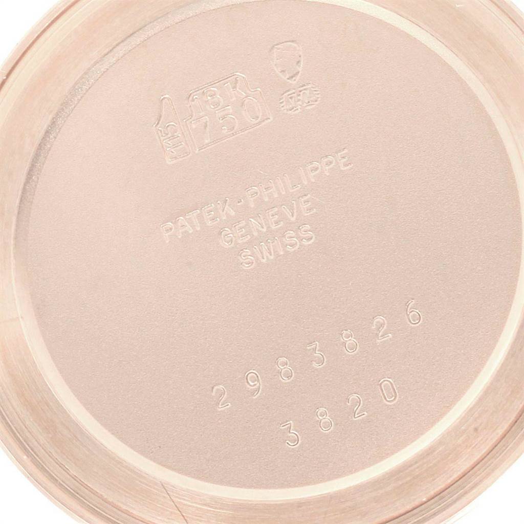 The image shows the inner case back of a Vintage model by Patek Philippe, displaying engravings and hallmarks.