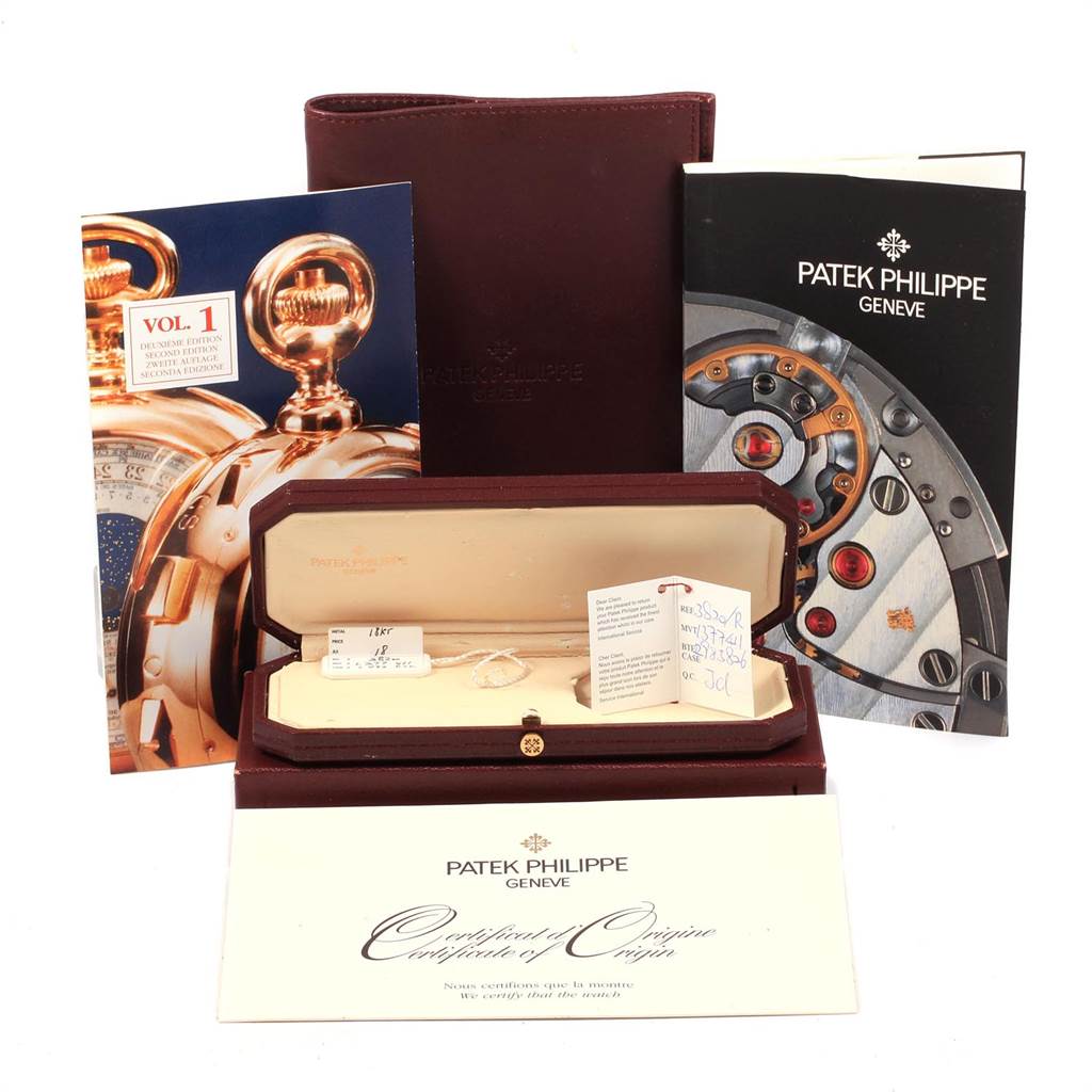 This image shows the packaging, booklets, and Certificate of Origin for a Patek Philippe Vintage model watch, with the watch case partially visible.