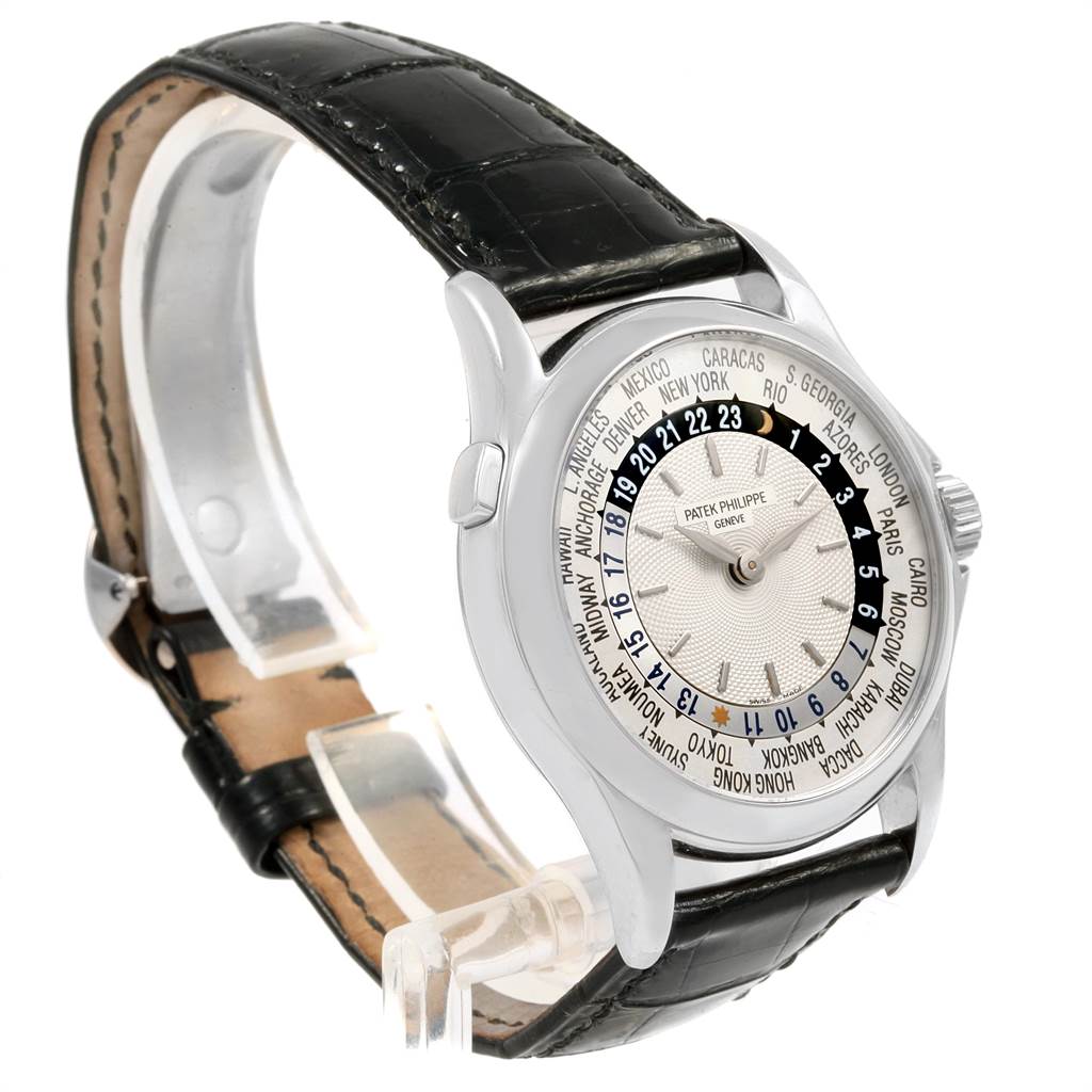 The image shows a Patek Philippe Complications 5110G Men
s White Gold Silver Dial 5110G Men
s White Gold Silver Dial watch from a side angle, highlighting its dial, bezel, and leather strap.