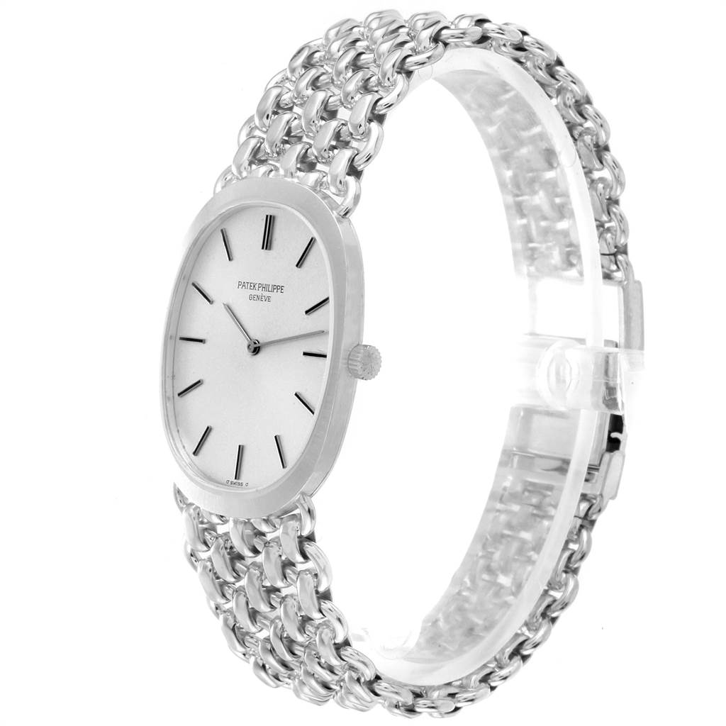 The image shows a side-angle view of a Patek Philippe Golden Ellipse 3577 Men's White Gold Silver Dial 3577 Men's White Gold Silver Dial watch, highlighting its dial and metal bracelet.