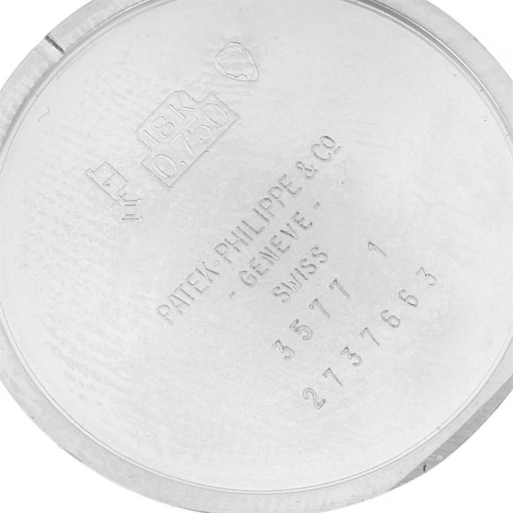 The image shows the inner side of the case back of a Patek Philippe Golden Ellipse 3577 Men's White Gold Silver Dial 3577 Men's White Gold Silver Dial watch, featuring engravings and hallmarks.