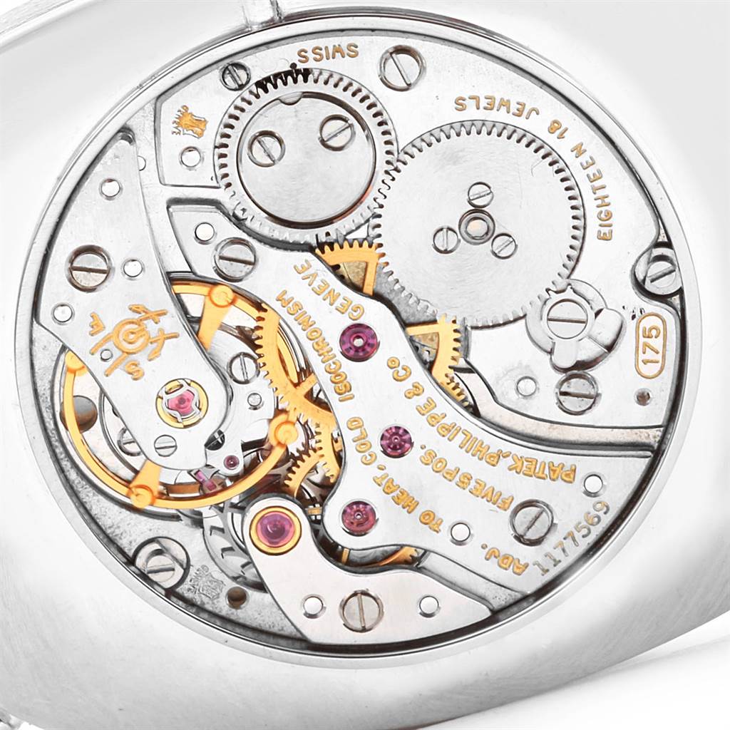 This image shows the intricate inner mechanics of a Patek Philippe Golden Ellipse 3577 Men's White Gold Silver Dial 3577 Men's White Gold Silver Dial watch from a close-up angle.