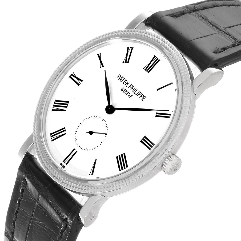 The image shows a Patek Philippe Calatrava 5119G Men's White Gold White Dial 5119G Men's White Gold White Dial watch at a three-quarter angle, highlighting the dial, bezel, and leather strap.