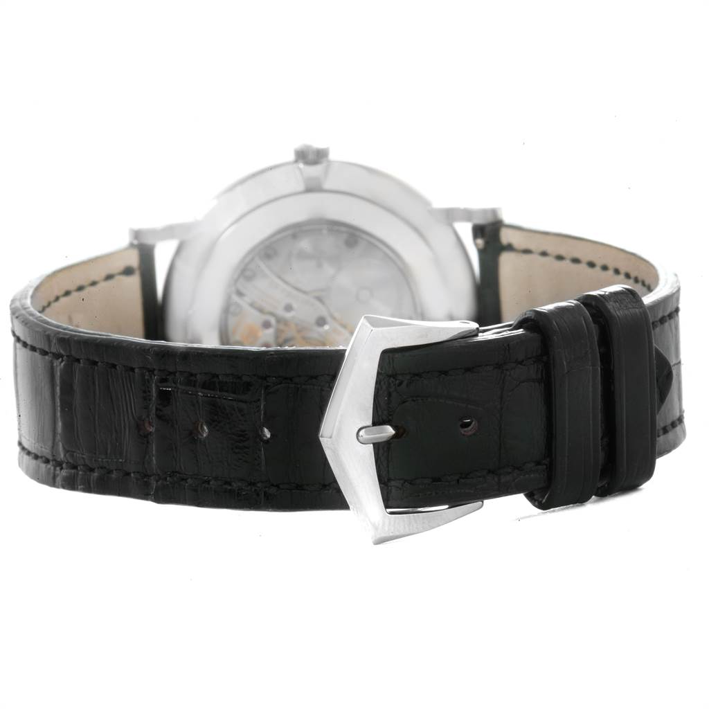 The image shows the rear angle of a Patek Philippe Calatrava 5119G Men's White Gold White Dial 5119G Men's White Gold White Dial watch focusing on the back of the case and the black leather strap with the buckle.