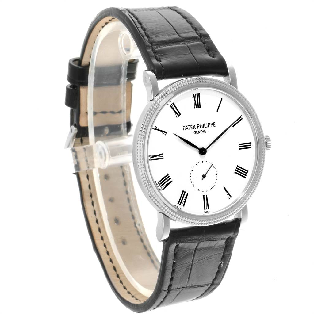 The Patek Philippe Calatrava 5119G Men's White Gold White Dial 5119G Men's White Gold White Dial watch is shown at an angled view, displaying the face, crown, bezel, and leather strap.