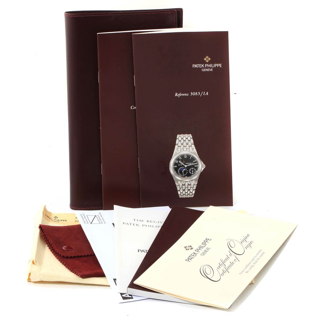 The image shows the Patek Philippe Neptune 5085A/1A-001 Men's Stainless Steel Black Dial 5085A/1A-001 Men's Stainless Steel Black Dial model watch manuals, certificate, and packaging.