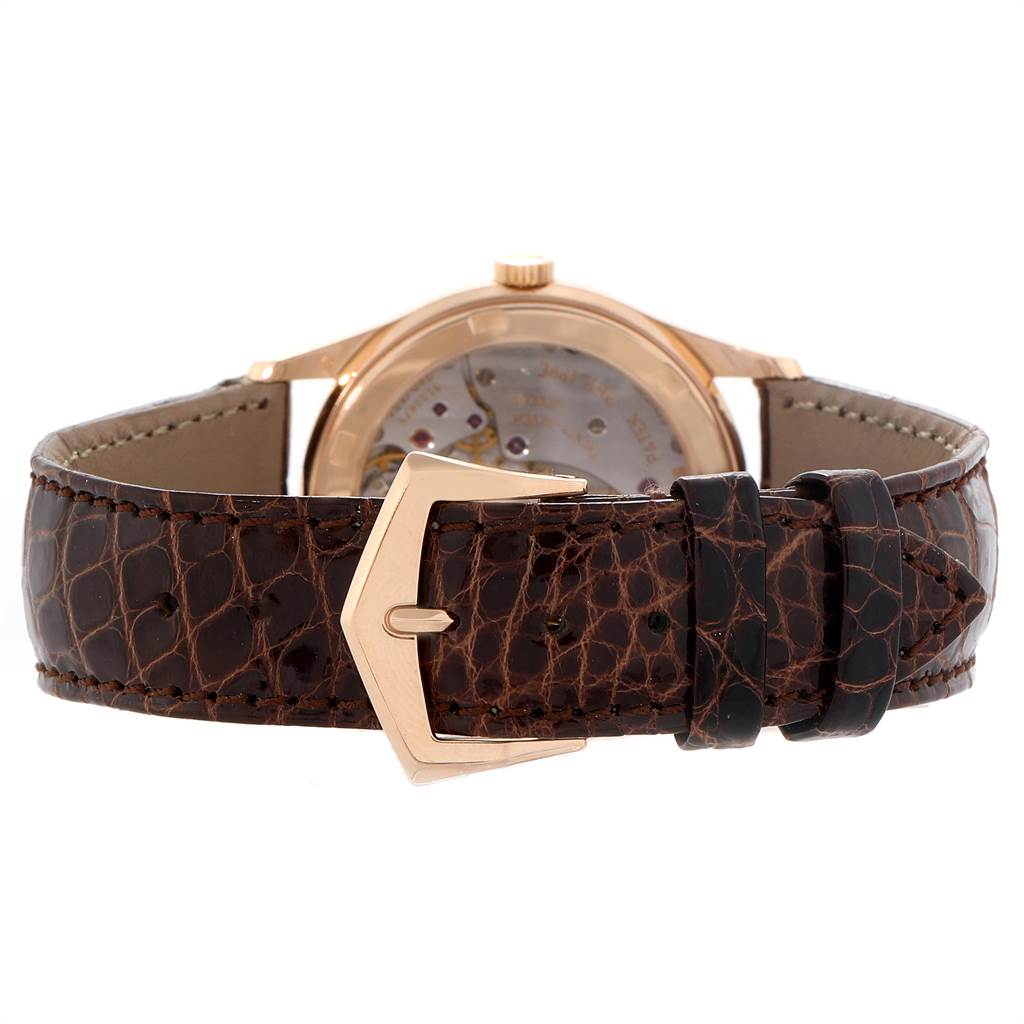 The image shows the back and buckle of a Patek Philippe Calatrava 5026R Men
s Rose Gold Silver Dial 5026R Men
s Rose Gold Silver Dial wristwatch with a brown leather strap.