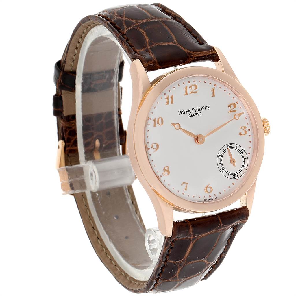 The image shows a Patek Philippe Calatrava 5026R Men
s Rose Gold Silver Dial 5026R Men
s Rose Gold Silver Dial watch at an angled view, displaying its face, strap, and crown.