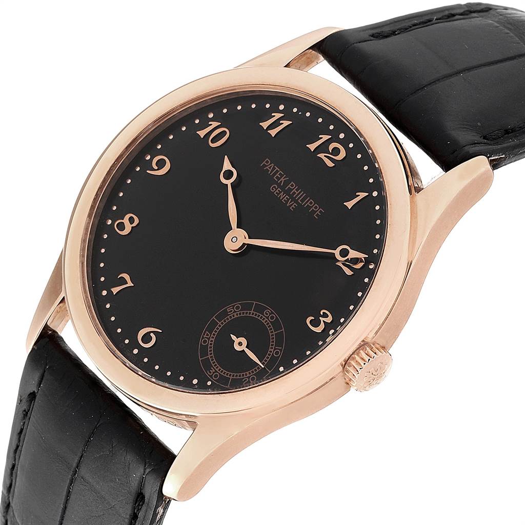 This image shows a Patek Philippe Calatrava 5026R Men's Rose Gold Black Dial 5026R Men's Rose Gold Black Dial watch at a slight angle, displaying the face, dial, and part of the black strap.