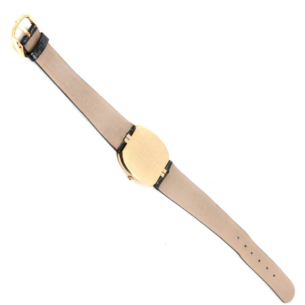 The image shows the back view and full strap of a Golden Ellipse watch by Patek Philippe.