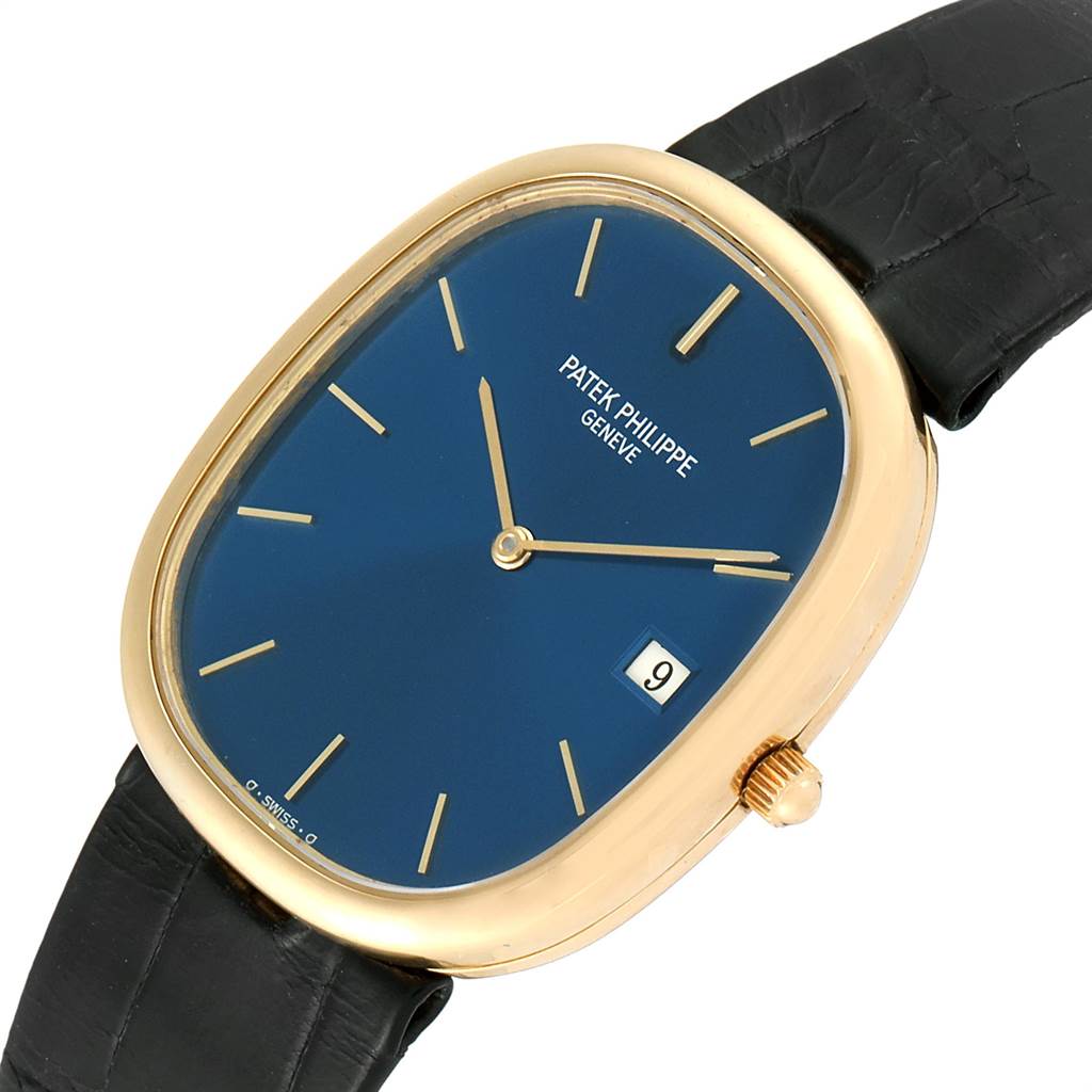 The image shows a top-down view of a Patek Philippe Golden Ellipse 3747 Men
s Yellow Gold Blue Dial 3747 Men
s Yellow Gold Blue Dial watch, highlighting its blue dial, gold case, and black strap.