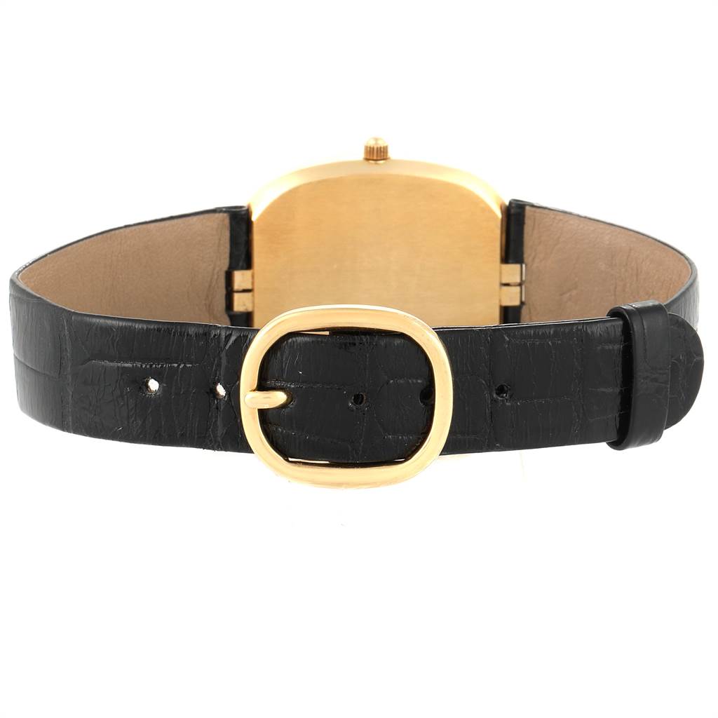 The image shows the back of the Patek Philippe Golden Ellipse 3747 Men
s Yellow Gold Blue Dial 3747 Men
s Yellow Gold Blue Dial watch, focusing on the black leather strap and gold buckle.