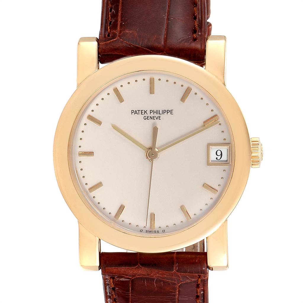 The image shows a front view of the Patek Philippe Calatrava 5012 Men's Yellow Gold Beige Dial 5012 Men's Yellow Gold Beige Dial watch, featuring its face, bezel, and leather strap.