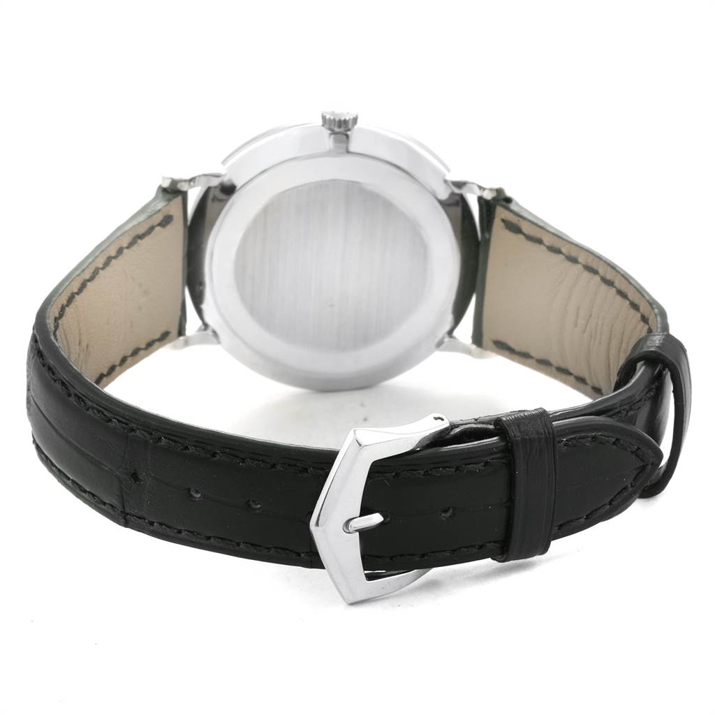 The image shows the back view of the Patek Philippe Calatrava 5022P Men's Platinum White Dial 5022P Men's Platinum White Dial watch, highlighting the caseback and leather strap with buckle.