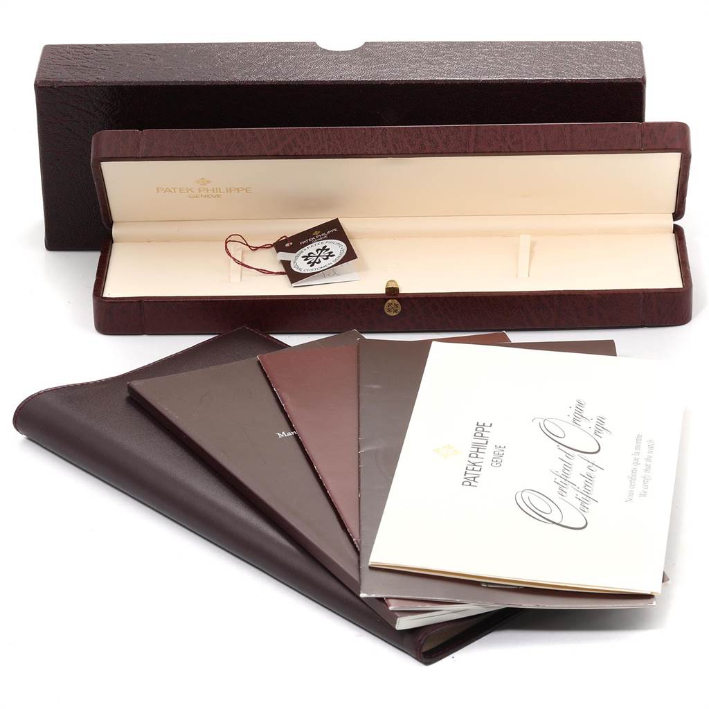 The image shows the packaging and documentation of a Patek Philippe Calatrava 5022P Men's Platinum White Dial 5022P Men's Platinum White Dial watch, including the box and certificates.