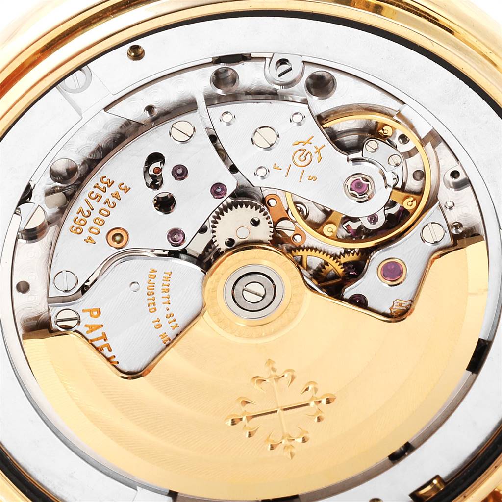 This image shows a detailed close-up view of the movement of the Patek Philippe 5146J Men
s Yellow Gold Beige Dial 5146J Men
s Yellow Gold Beige Dial Complicated Annual Calendar Yellow Gold Men
s Watch 5146J model.