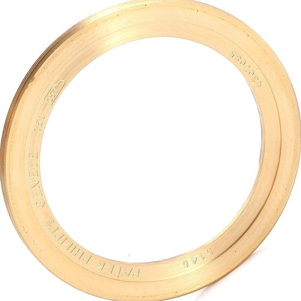 This image shows the yellow gold bezel of a Patek Philippe 5146J Men
s Yellow Gold Beige Dial 5146J Men
s Yellow Gold Beige Dial Complicated Annual Calendar Mens Watch, model 5146J.