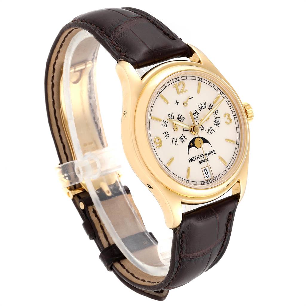 The Patek Philippe 5146J Men
s Yellow Gold Beige Dial 5146J Men
s Yellow Gold Beige Dial Complicated Annual Calendar Yellow Gold Men
s Watch 5146J is shown from a front angle, displaying its face and leather strap.