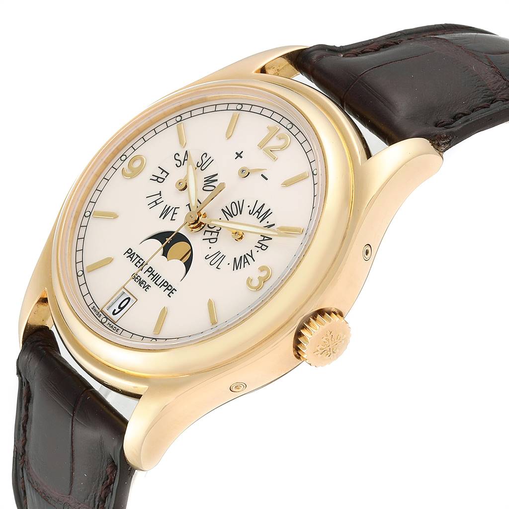 This is a side-angle view of the Patek Philippe 5146J Men
s Yellow Gold Beige Dial 5146J Men
s Yellow Gold Beige Dial Complicated Annual Calendar Yellow Gold Mens Watch 5146J, showing the watch face, crown, and strap.