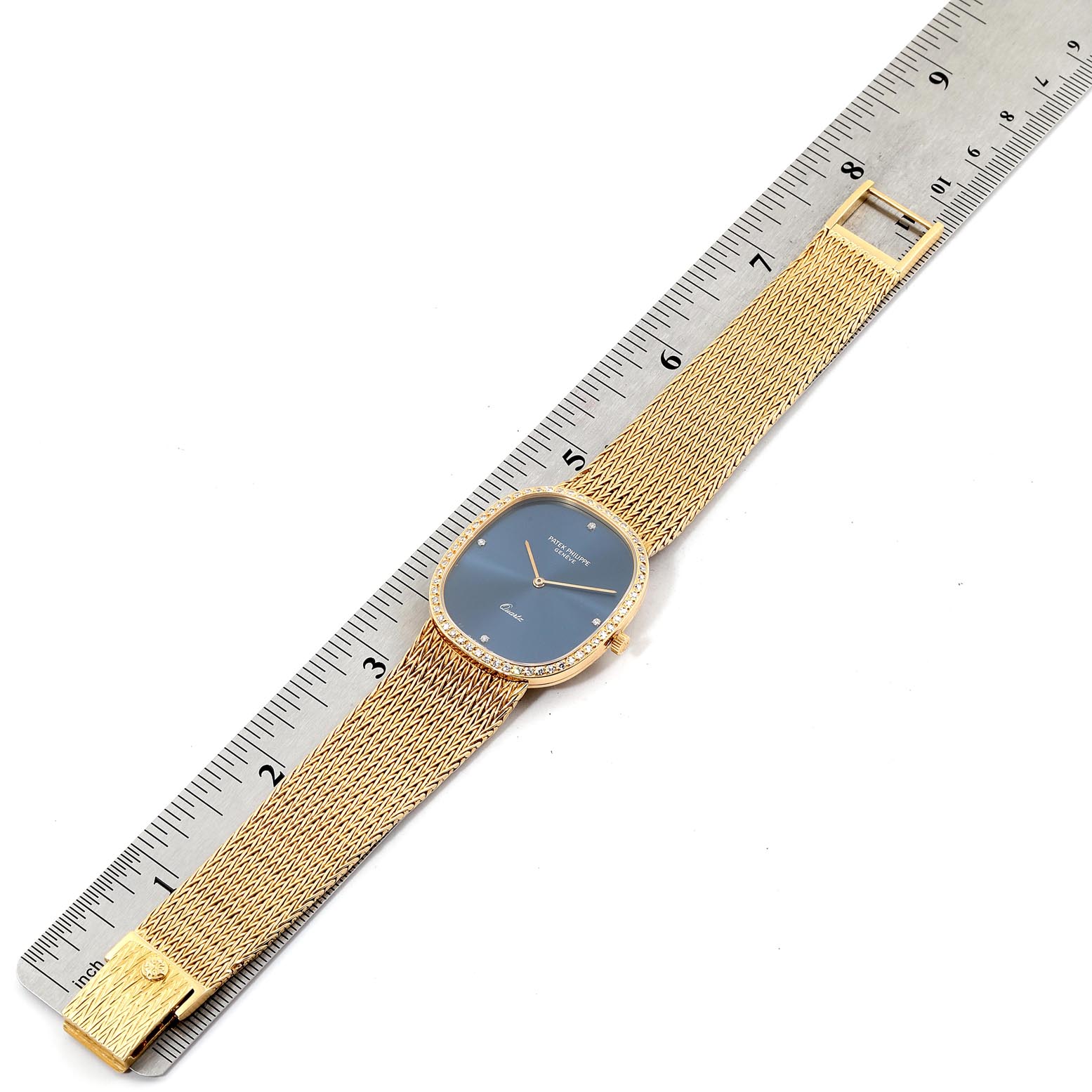 The image shows a top-down view of the Patek Philippe Golden Ellipse 3875 Men's Yellow Gold Blue Dial 3875 Men's Yellow Gold Blue Dial watch, with the entire band and face visible alongside a ruler for scale.