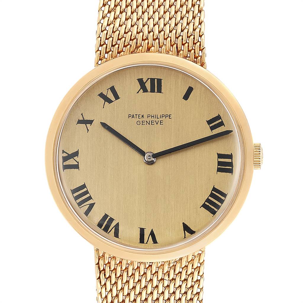This image shows a front view of the Patek Philippe Calatrava 3562 Men's Yellow Gold Champagne Dial 3562 Men's Yellow Gold Champagne Dial watch, highlighting its dial, hands, and woven band.