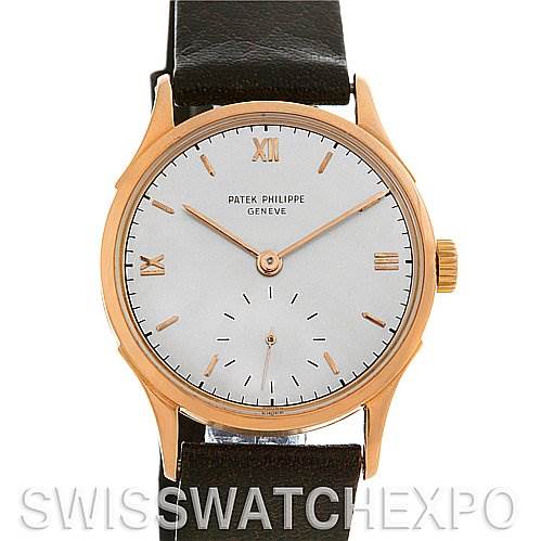 The image shows a front view of a vintage Patek Philippe watch, featuring its dial, hands, crown, and leather strap.